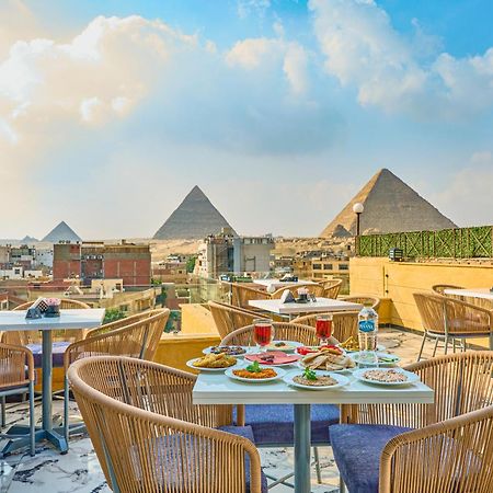 Hotel Cleopatra Tower Pyramid View à Kafret el-Gabal Extérieur photo