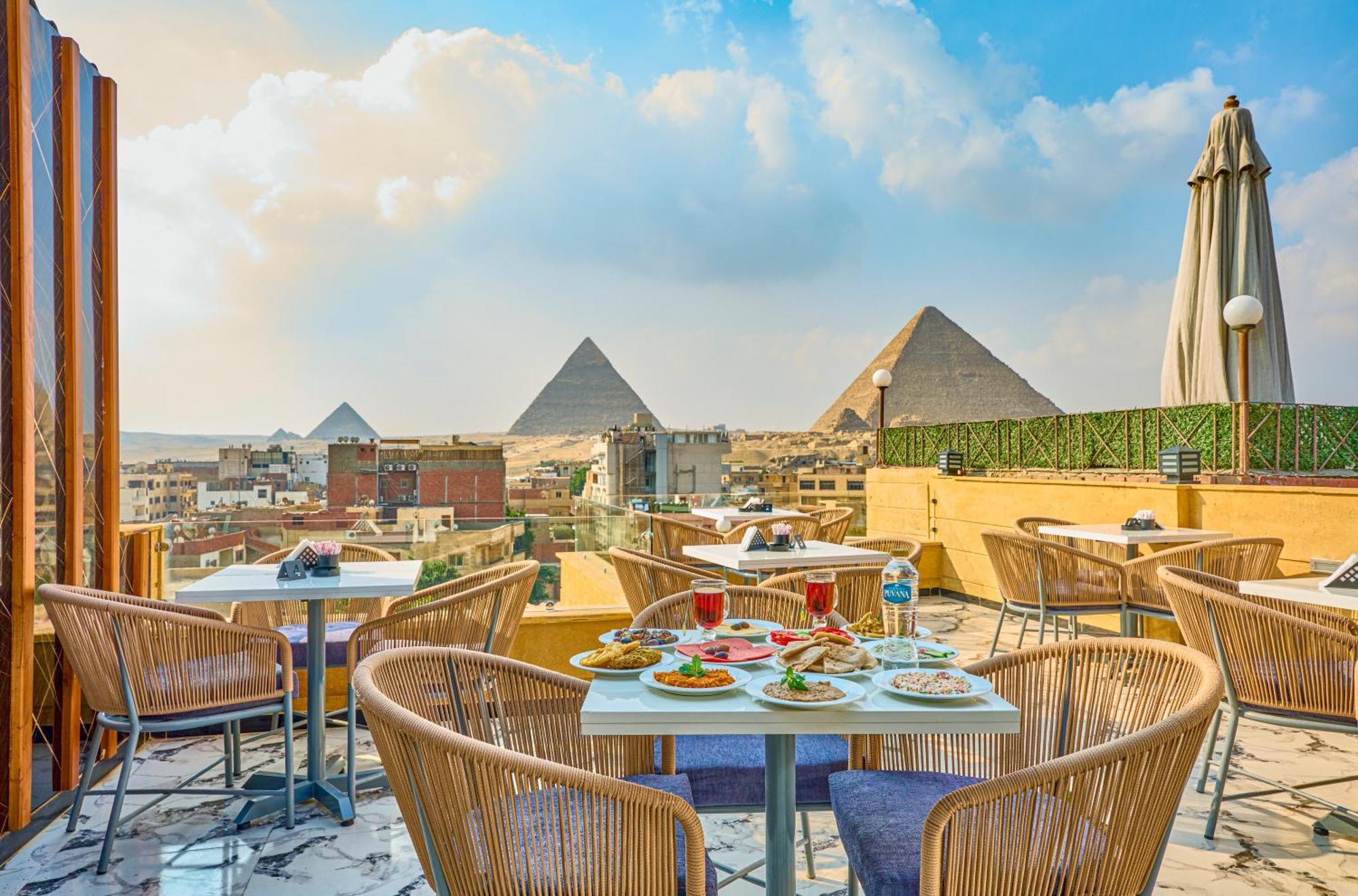 Hotel Cleopatra Tower Pyramid View à Kafret el-Gabal Extérieur photo